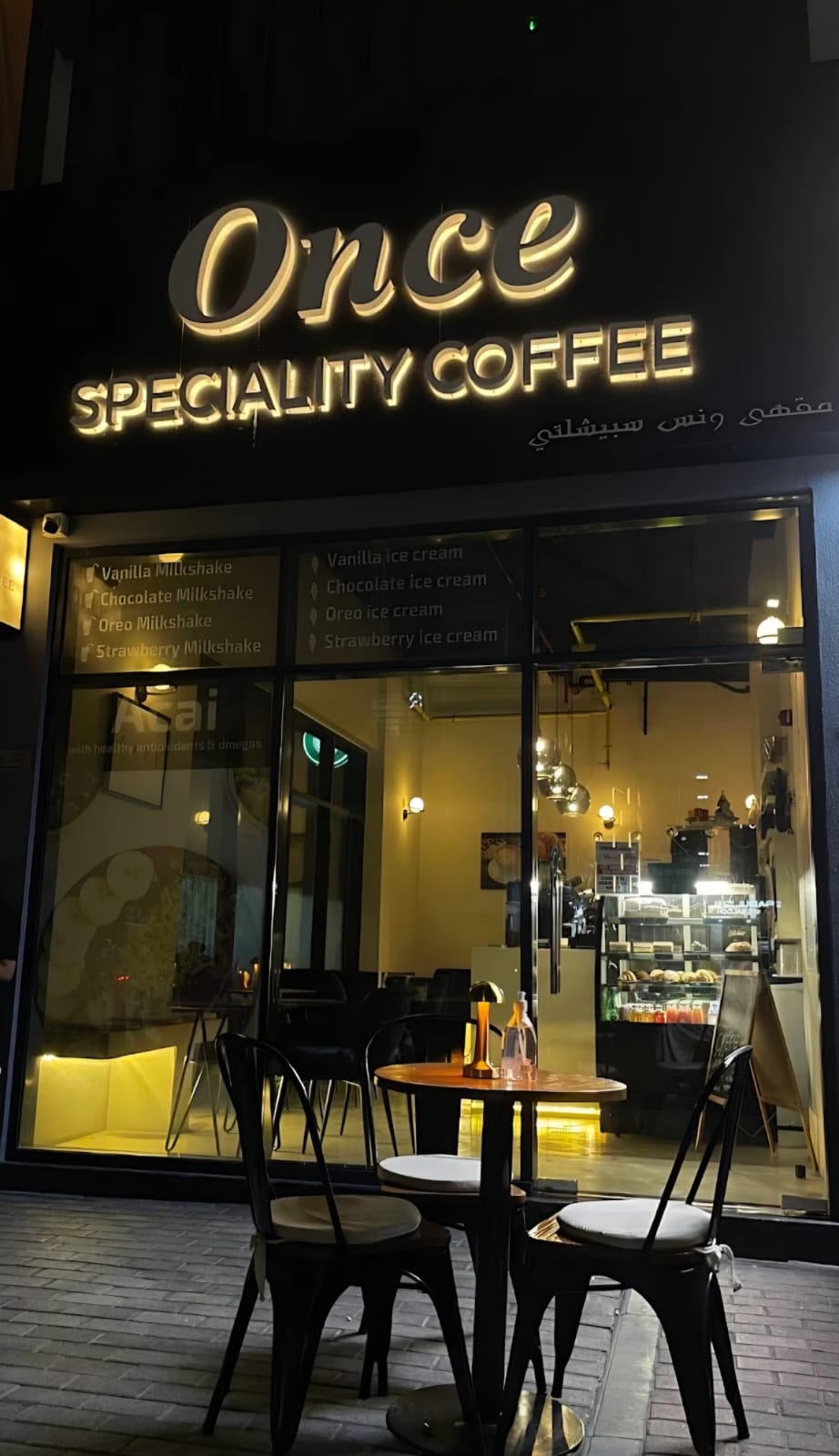 The Once Speciality Coffee storefront at night, Al Satwa